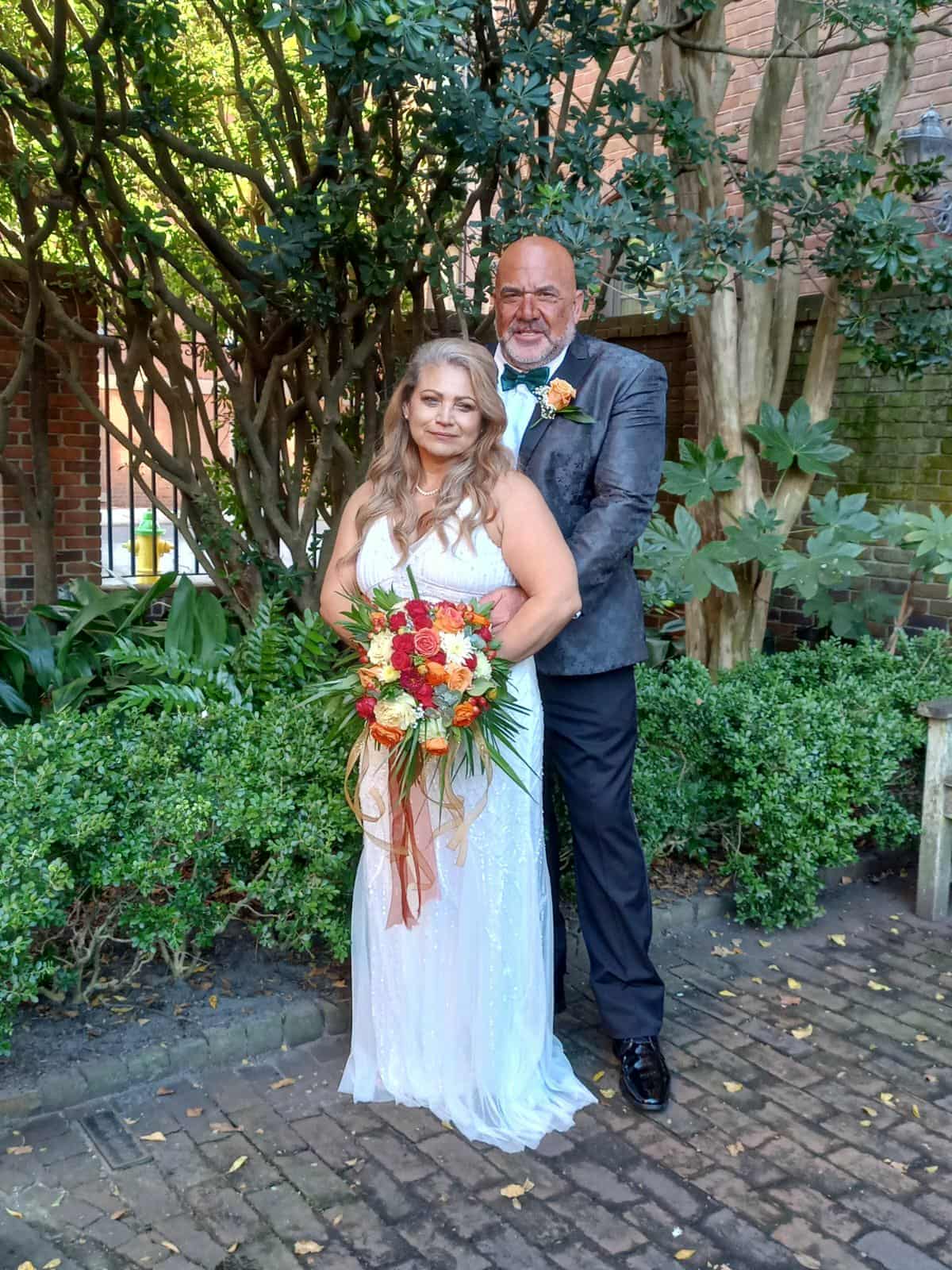 Hammer and his wife on their wedding day in beautiful formal attire