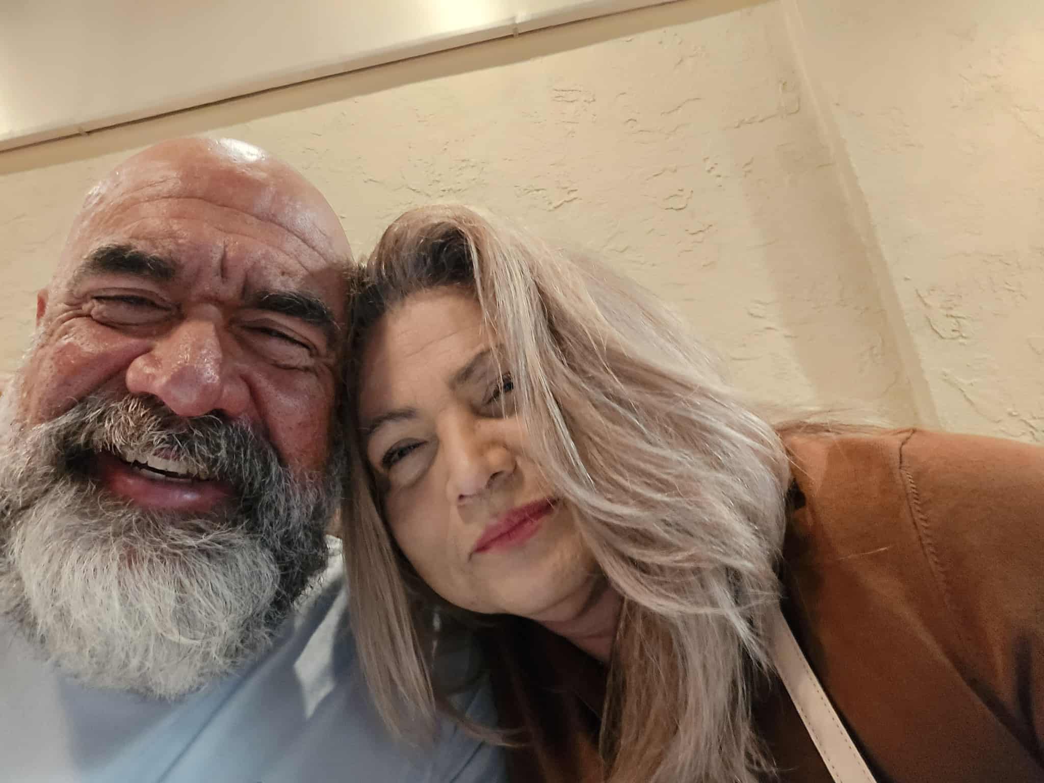 Intimate close-up selfie of Hammer and his wife showing their loving relationship